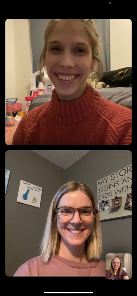 A screenshot of two women on a video chat. On the top, a woman is wearing an orange sweater. On the bottom, a woman has glasses and is wearing a pink shirt.