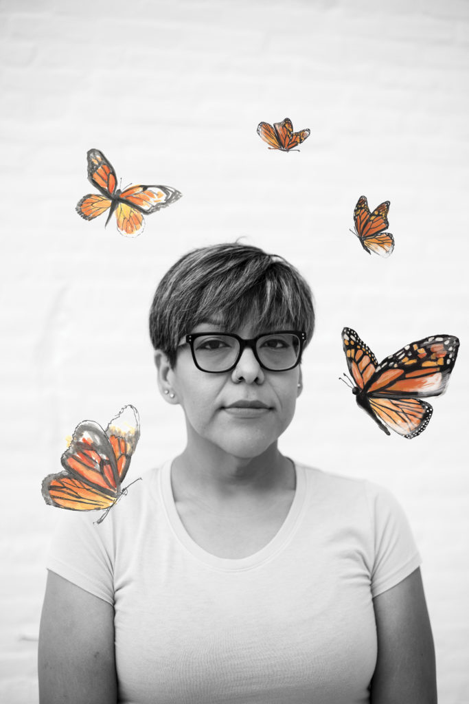 A black and white image of a woman with short hair and glasses against a white background. Illustrations of monarch butterflies overlay the image.